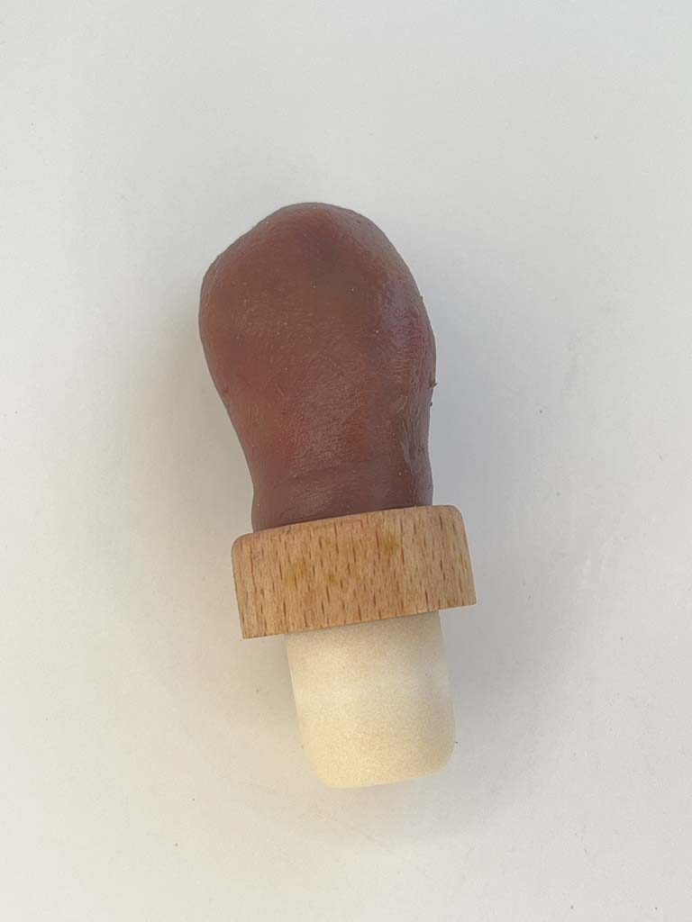 Dark skinned human toe bottle stopper